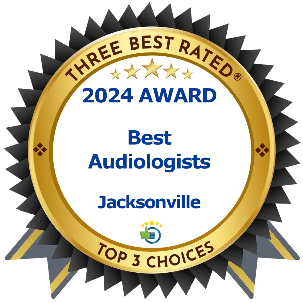 Gold and black award badge with the text “THREE BEST RATED 2024 AWARD Best Audiologists Jacksonville TOP 3 CHOICES” and a small blue and green logo at the bottom.